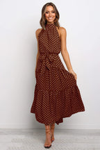 Brown sleeveless halter long dress with white polka dots and tied waist