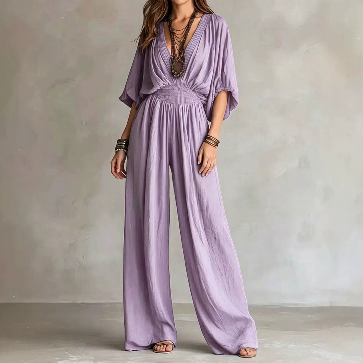 Lavender purple V-neck wide-leg jumpsuit with elastic waist and draped short sleeves
