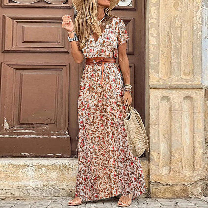 Boho maxi dress in white with small red floral print, short sleeves and tied waist