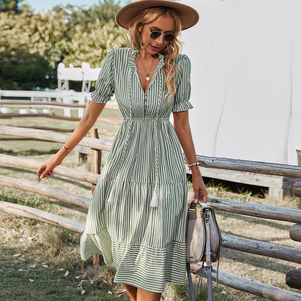 Green striped midi shirt dress with tiered skirt, puff sleeves, and button front
