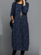 Navy printed long-sleeve midi dress with round neckline and patch pockets