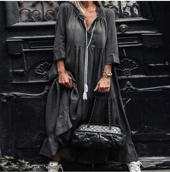 Black tiered maxi dress with V-neck, front buttons and tassel tie, three-quarter sleeves