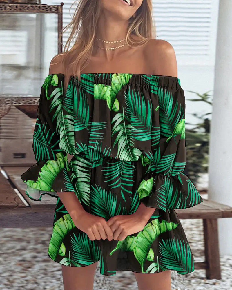 IRCA off-shoulder summer dress in black with green palm leaf print, tiered ruffle skirt
