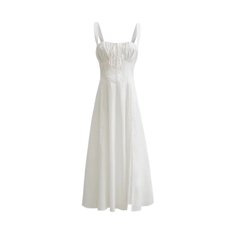 White mid-length dress with spaghetti straps, gathered bodice, and flared skirt