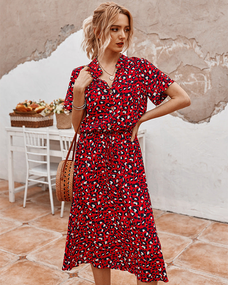 Red printed V-neck midi dress with short sleeves and gathered waist