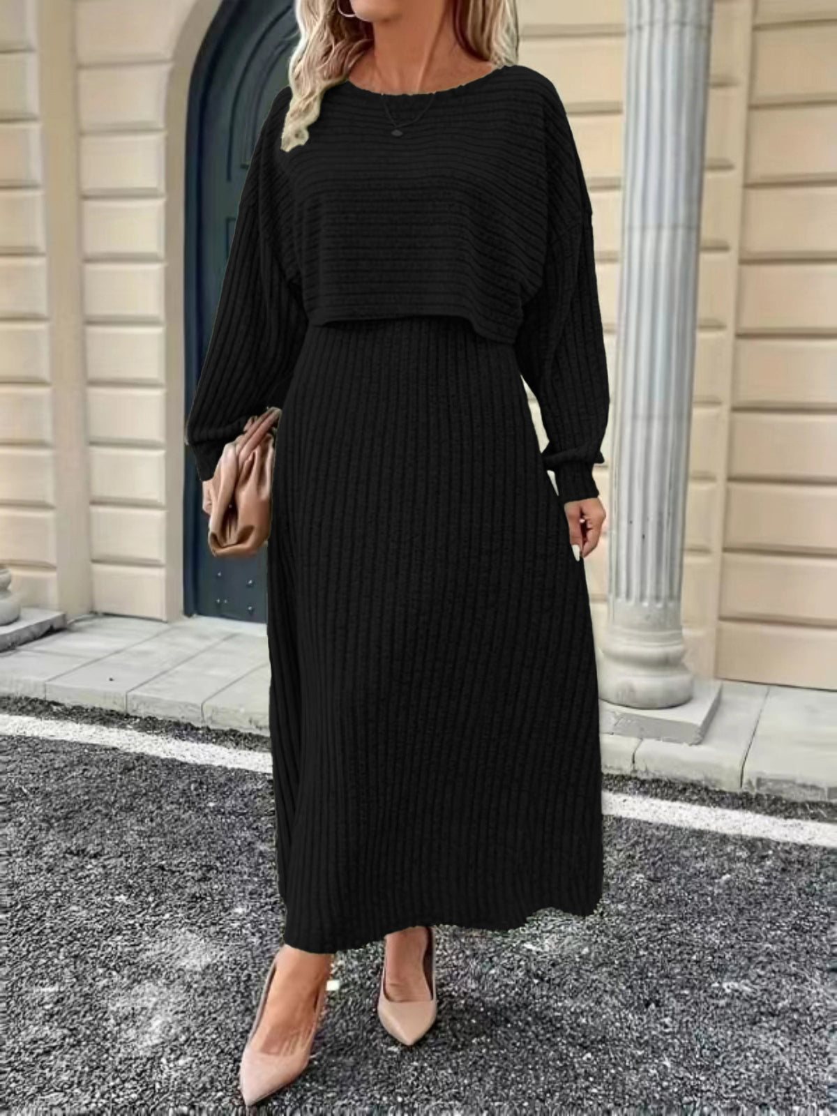 Black knit co-ord set with cropped long-sleeve top and draped high-rise midi skirt