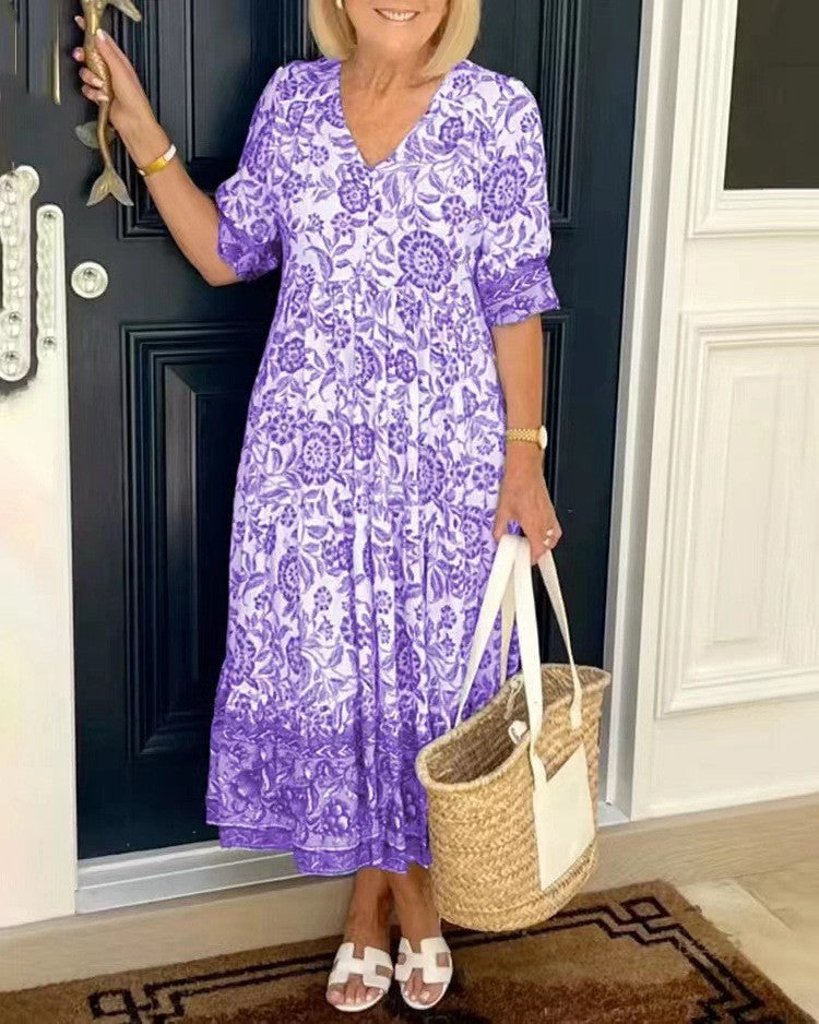 BRONYA V-neck midi dress in purple floral print, short sleeves, tiered skirt.