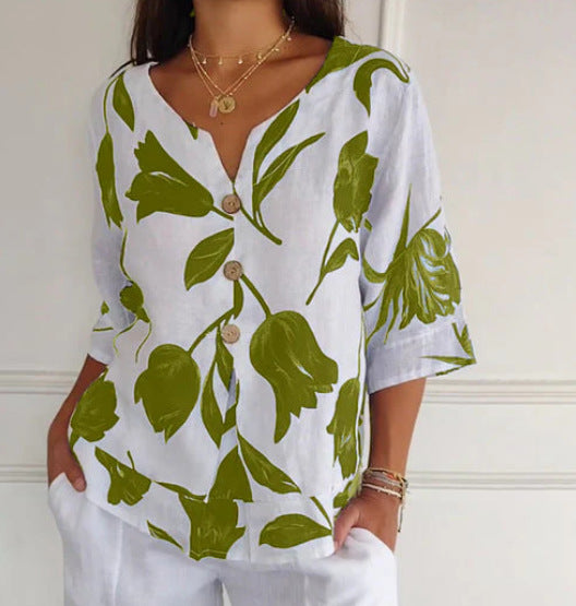 White summer button-up shirt with green floral leaf print and button front, V-neck