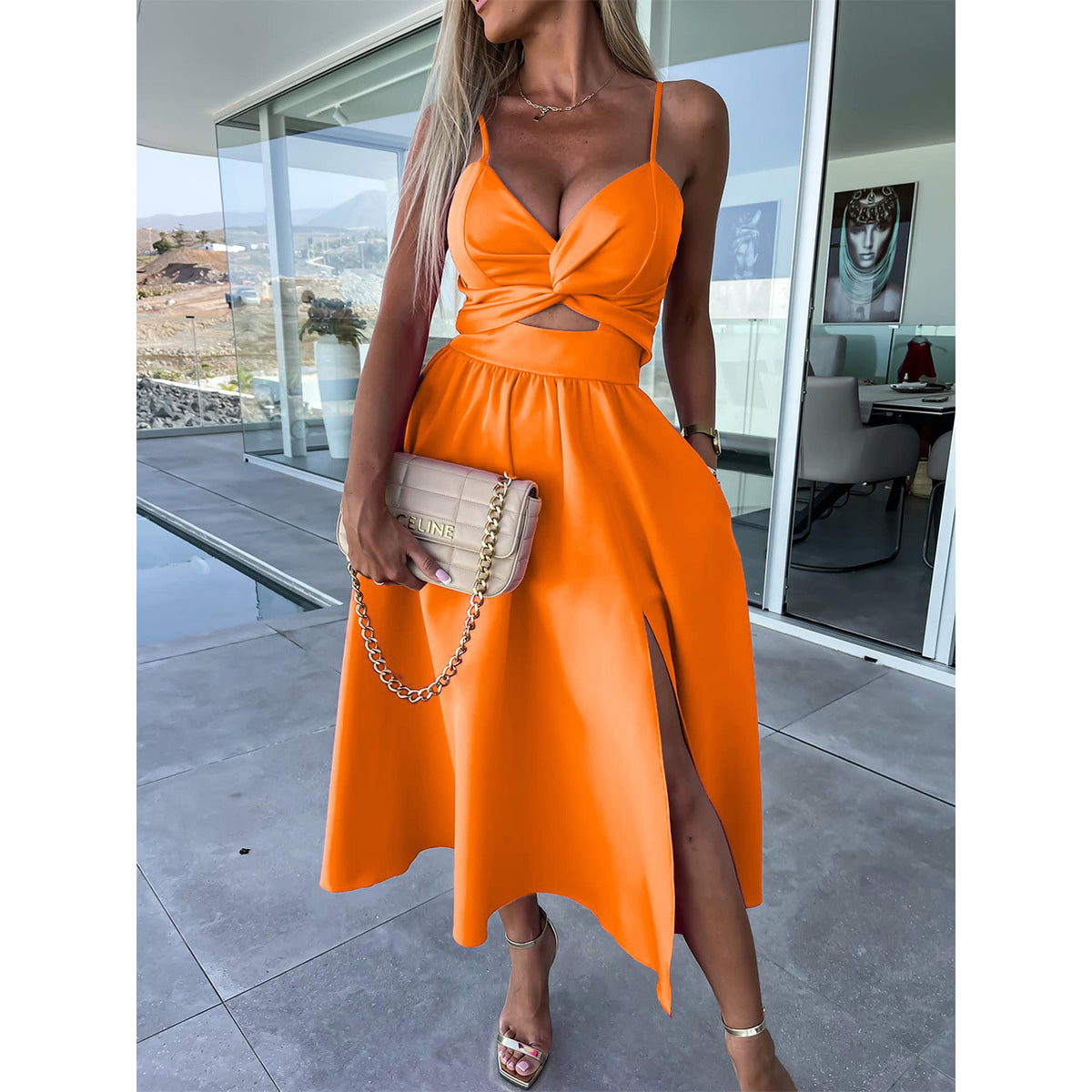 Orange sleeveless midi dress with V-neck twist bodice and side slit
