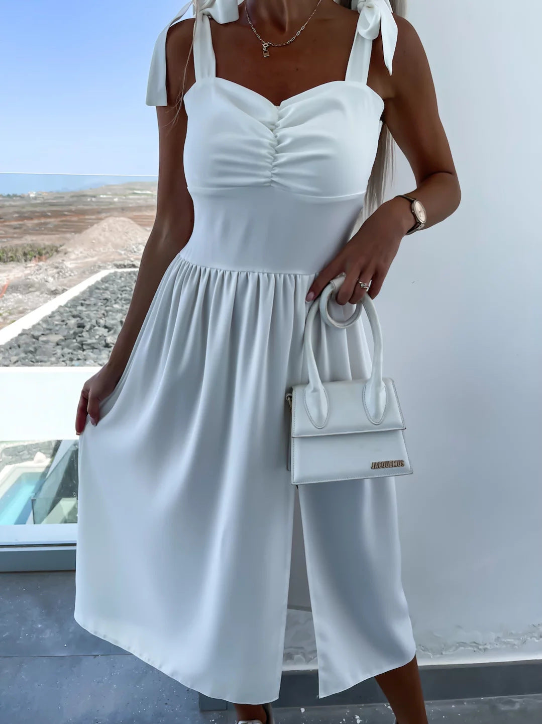 White midi summer dress with tie shoulder straps, button-front bodice and gathered skirt