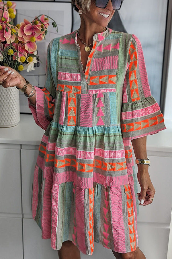 Women's patchwork summer dress side view with V-neck, long sleeves, and tiered ruffle hem