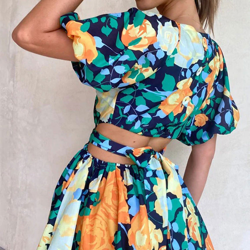 Floral casual summer dress with puff sleeves and tie waist, navy and yellow tones