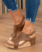 Women's brown open-toe wedge sandals with ankle strap and stud accents