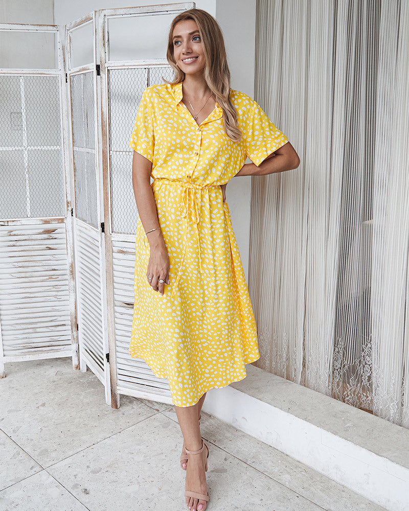 Yellow printed V-neck midi dress with short sleeves and belt tie