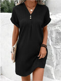 Black mini dress with V-neck button front, short sleeves, vertical stripe texture