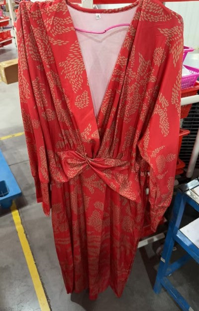 Red patterned summer dress on hanger, V-neck wrap with waist tie, long sleeves