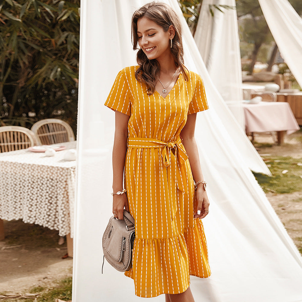 Yellow striped midi dress with V-neck, short sleeves, and waist tie
