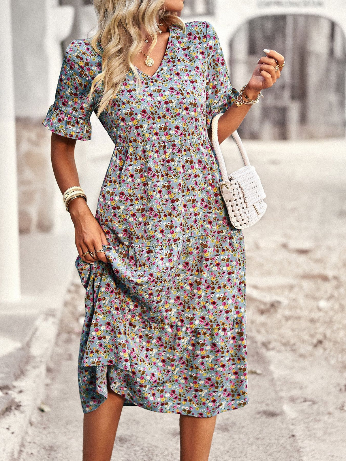 Floral V-neck midi dress in apricot with short puff sleeves and cinched waist