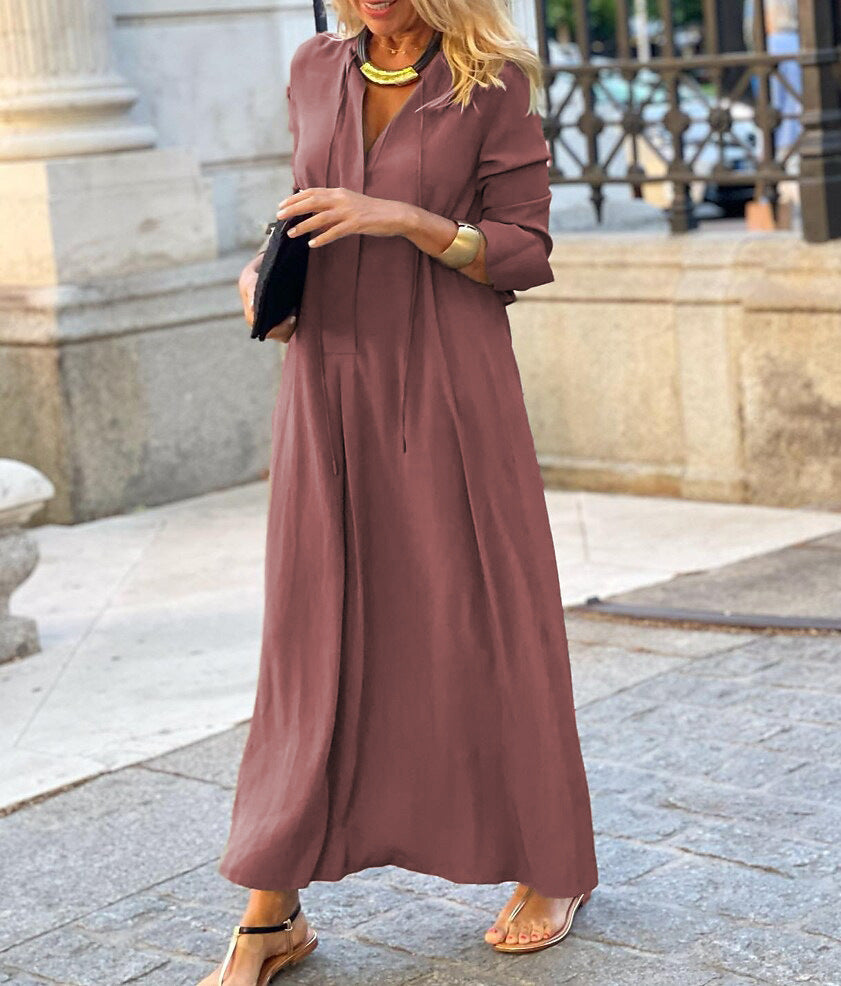 Wine red long-sleeve V-neck maxi dress with relaxed fit and button-front styling