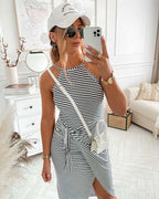 Sleeveless striped midi dress in navy and white with tied waist and side slit