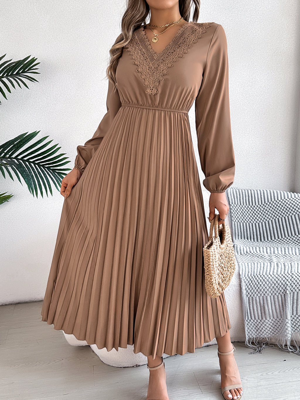 Khaki pleated midi dress with V-neck lace trim and long balloon sleeves, side view
