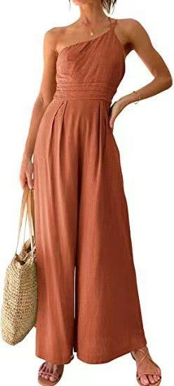 Rust-orange halter-neck wide-leg jumpsuit with smocked bodice and elastic waist