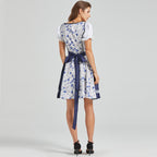 Blue and white folk dress with floral bodice, corset lacing, puff sleeves