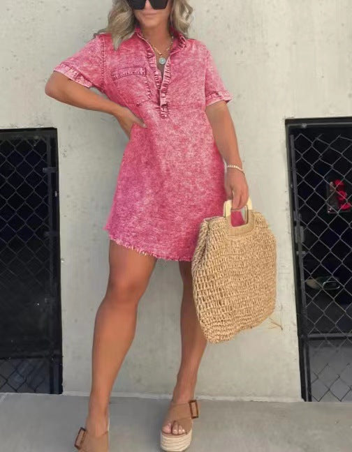 Bright pink denim-style casual dress with button placket, short sleeves, and frayed hem