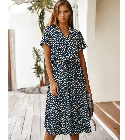 Navy printed V-neck midi dress with short sleeves and tie waist
