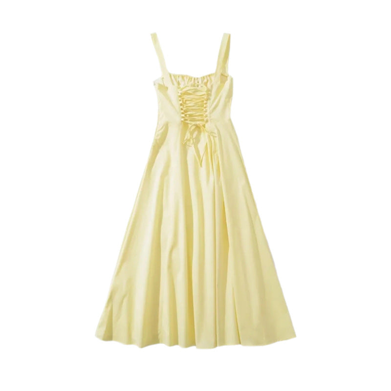 Light yellow mid-length dress with ruched neckline and gathered waist, pleated skirt
