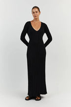 Black V-neck midi dress with long sleeves and vertical ribbed lines