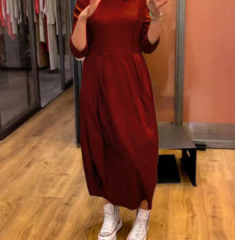 Dark red long-sleeve midi dress with cinched waist and full skirt