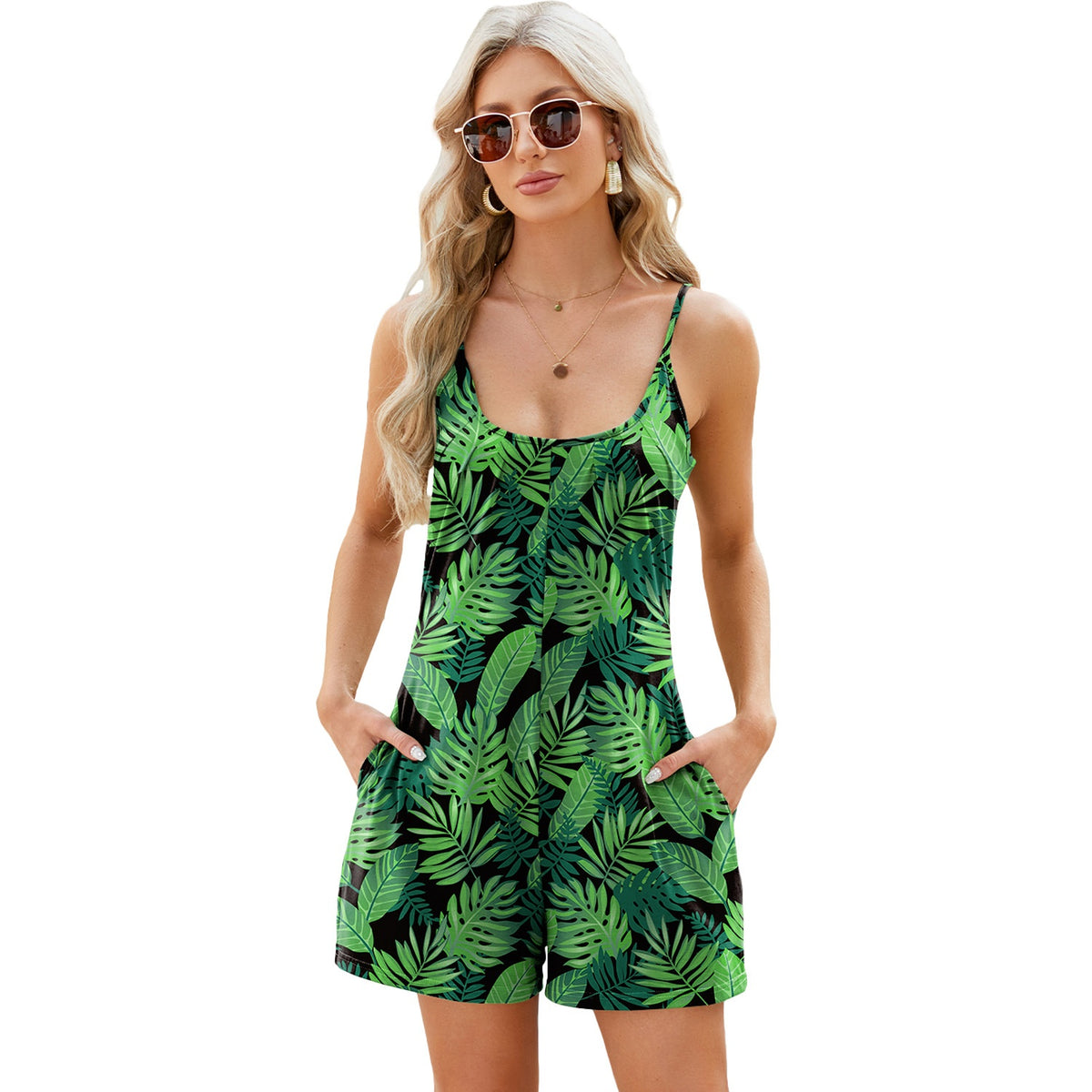 Loose-fit mini dress with spaghetti straps, green leaf print, scoop neckline and pockets