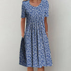 Casual blue and white patterned dress with short sleeves, round neckline, and gathered skirt