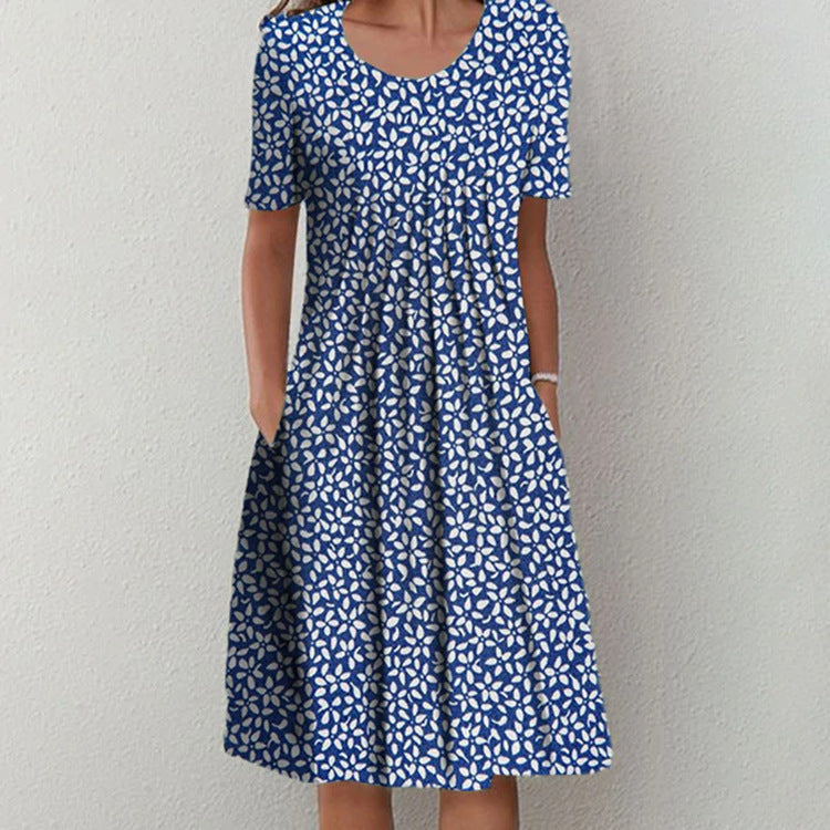 Casual blue and white patterned dress with short sleeves, round neckline, and gathered skirt