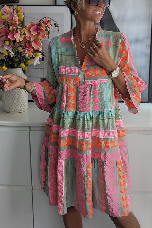 Manuela summer dress, teal tiered skirt, V-neck and long sleeves, pink/orange geometric pattern