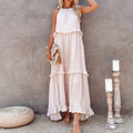 White tiered maxi dress with layered ruffles and sleeveless high neckline