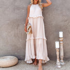 White tiered maxi dress with layered ruffles and sleeveless high neckline