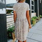 Leopard-print mini dress, short sleeves, gathered waist with flowy skirt in light gray