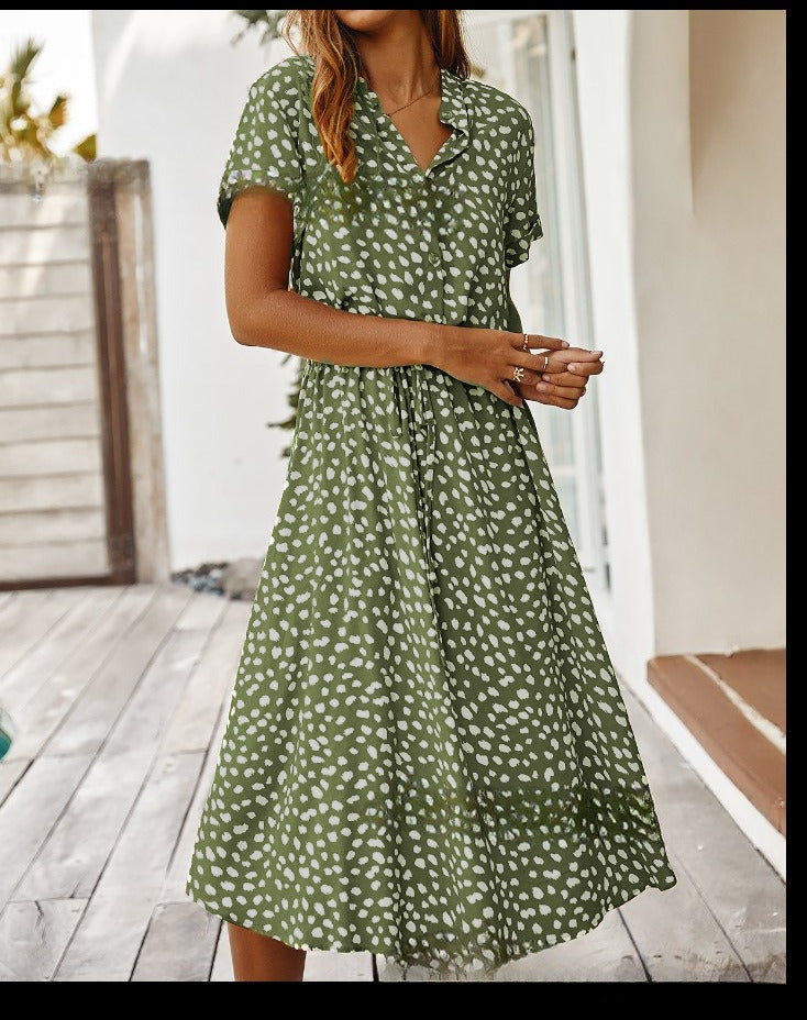 Green printed V-neck midi dress with short sleeves and gathered waist