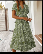 Green printed V-neck midi dress with short sleeves and gathered waist