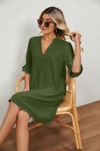 Army green V-neck midi dress with puff sleeves and flared cuffs, loose fit