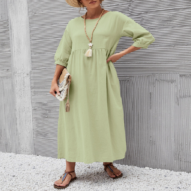 Light green long maxi dress with gathered neckline and three-quarter sleeves