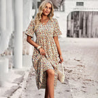 Floral apricot midi dress with short sleeves and gathered skirt