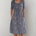 Black casual floral dress with short sleeves and round neckline, midi length