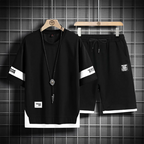Men’s lounge set: black crewneck shirt and black drawstring shorts with long necklace