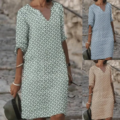 NORA elegant dress shown in blue and beige patterns, V-neck with 3/4 sleeves