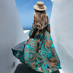 Teal patterned maxi dress with long flowy skirt and wide sleeves
