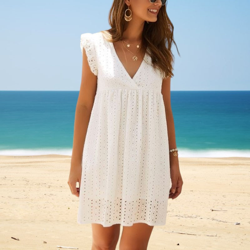 White sleeveless V-neck summer dress with eyelet texture and scalloped hem