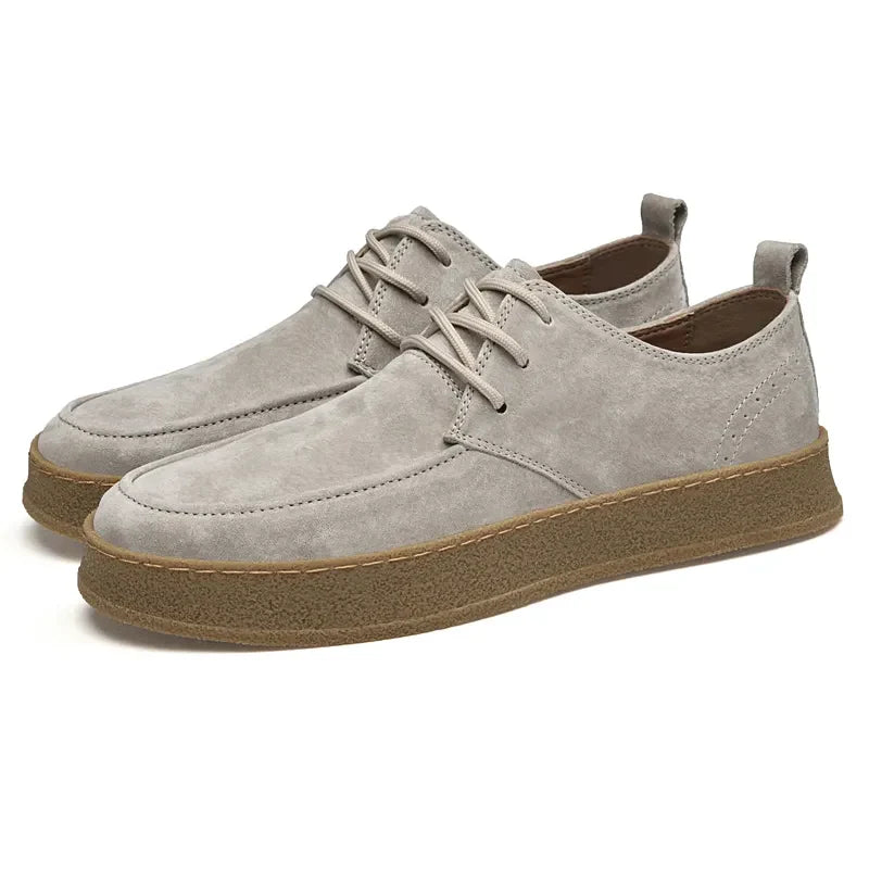 Suede lace-up sneakers with gum rubber sole, front angled product view